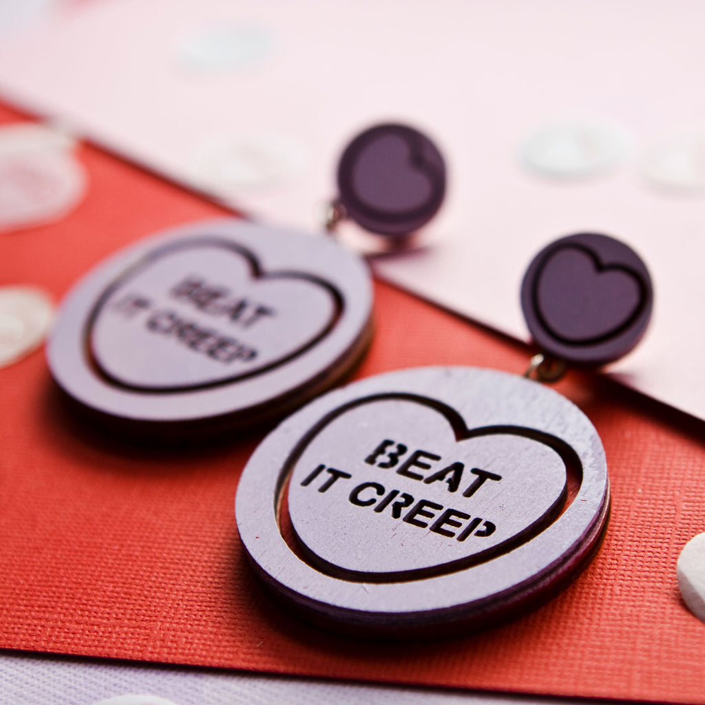 Candy & Kitsch candy heart earrings sits in a kitsch interior design in the variation ’beat it creep' inspired by crybaby