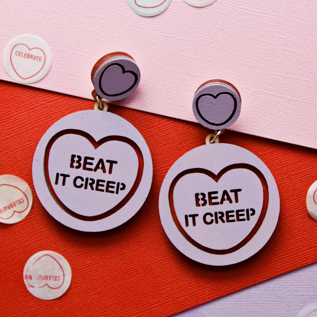 Candy & Kitsch candy heart earrings sits in a kitsch interior design in the variation ’beat it creep' inspired by crybaby