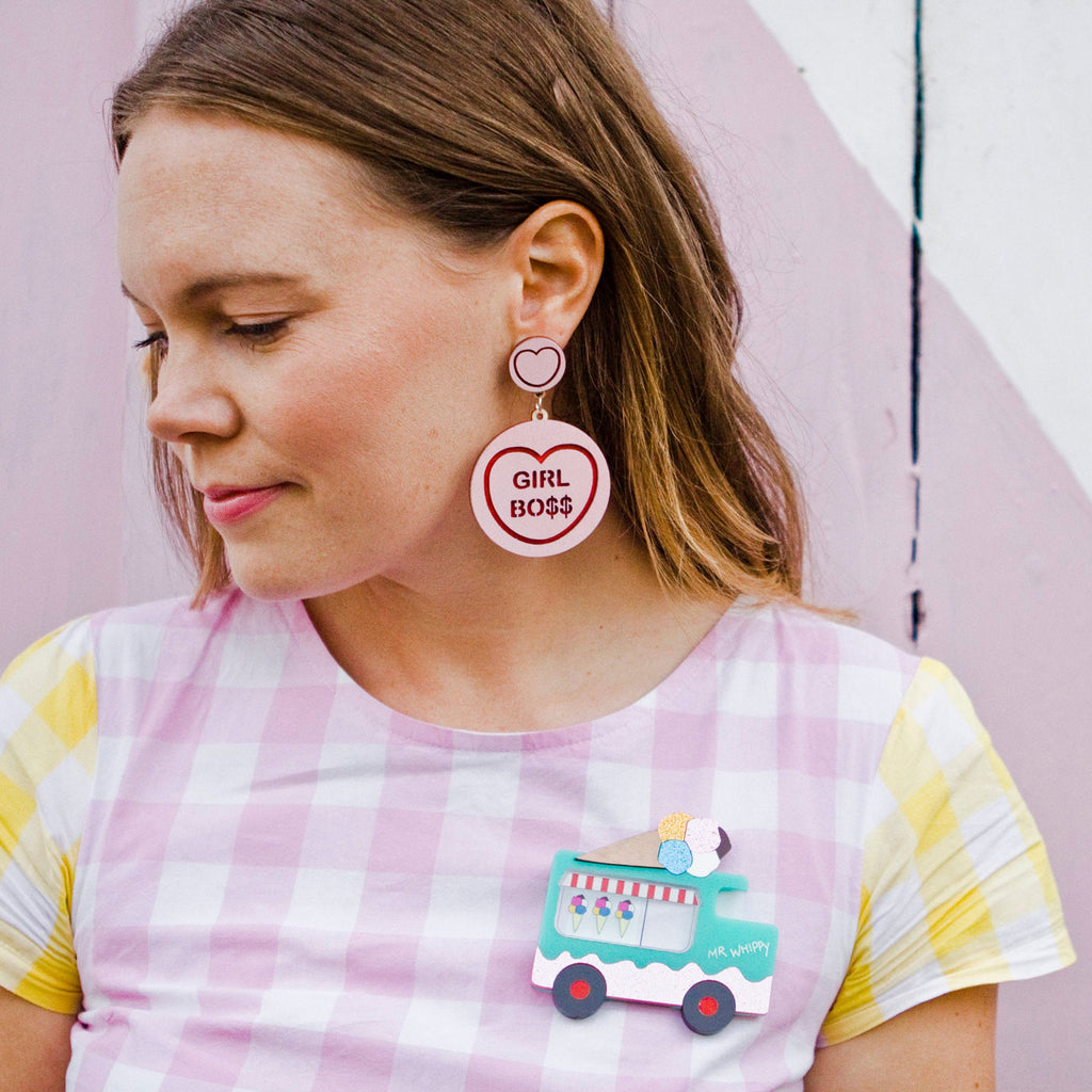 Candy & Kitsch candy heart earrings sits in a kitsch interior design in the variation ’girl boss'