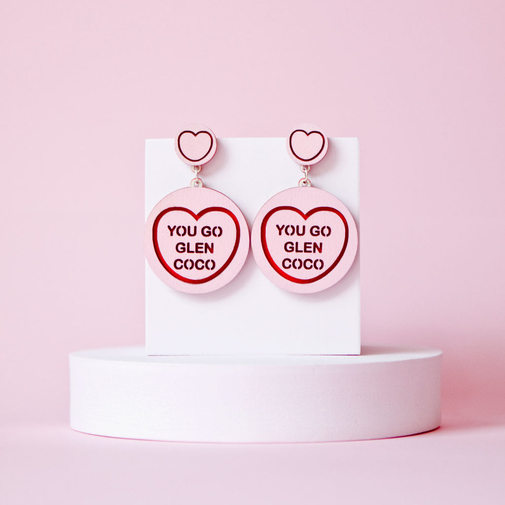 Candy & Kitsch candy heart earrings sits in a kitsch interior design in the variation ’you go glen coco' inspired by mean girls