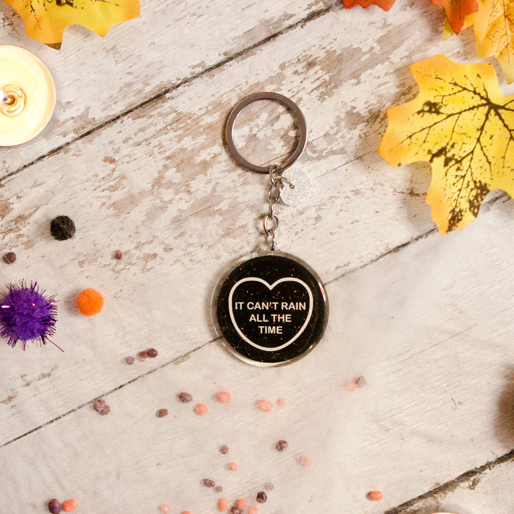 Candy & Kitsch candy heart keyring keychain sits in a kitsch interior design in the variation ’it can't rain all the time' inspired by The Crow