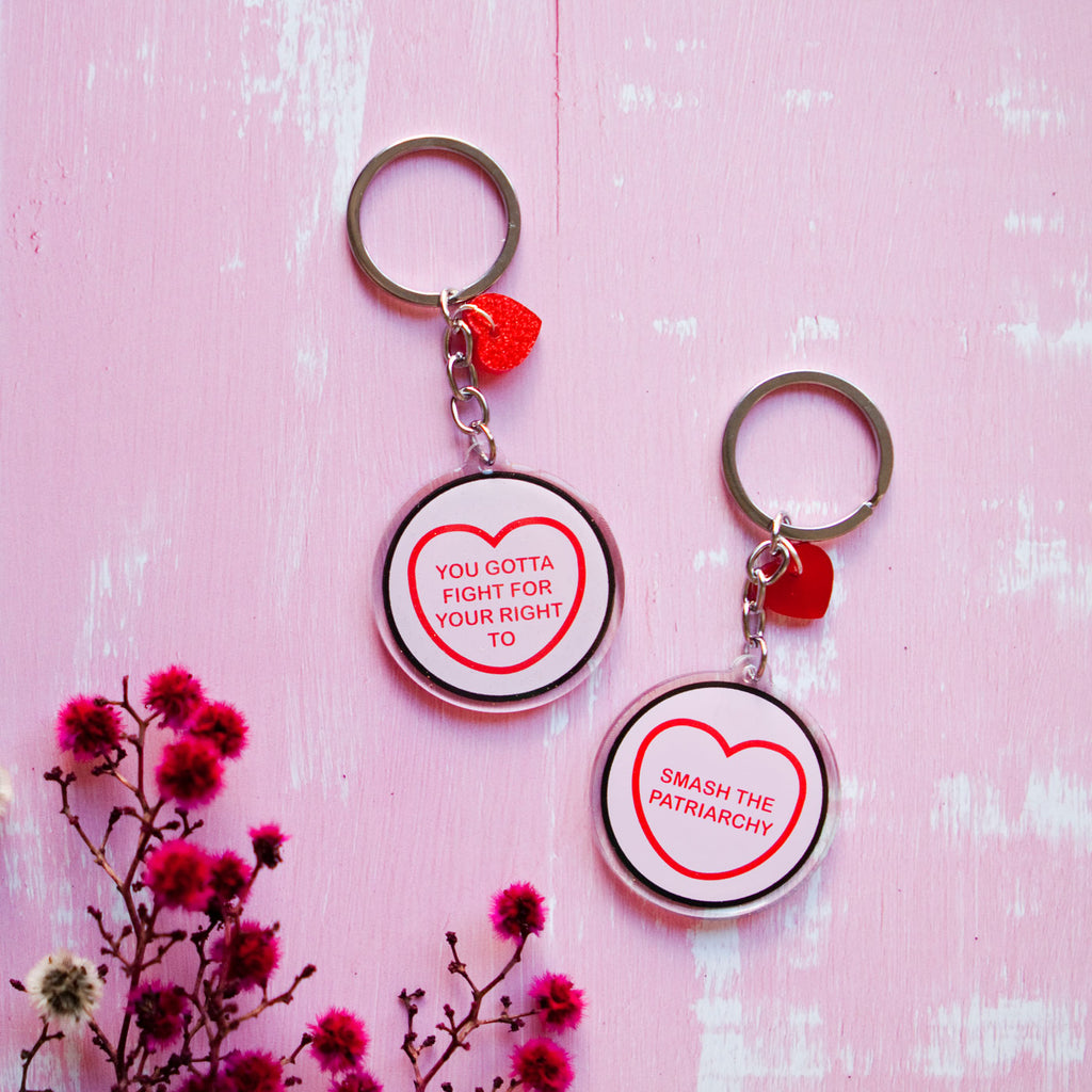 Candy & Kitsch candy heart keyring keychain sits in a kitsch interior design in the variation ’you gotta fight for your right to smash the patriarchy' inspired by The beastie Boys