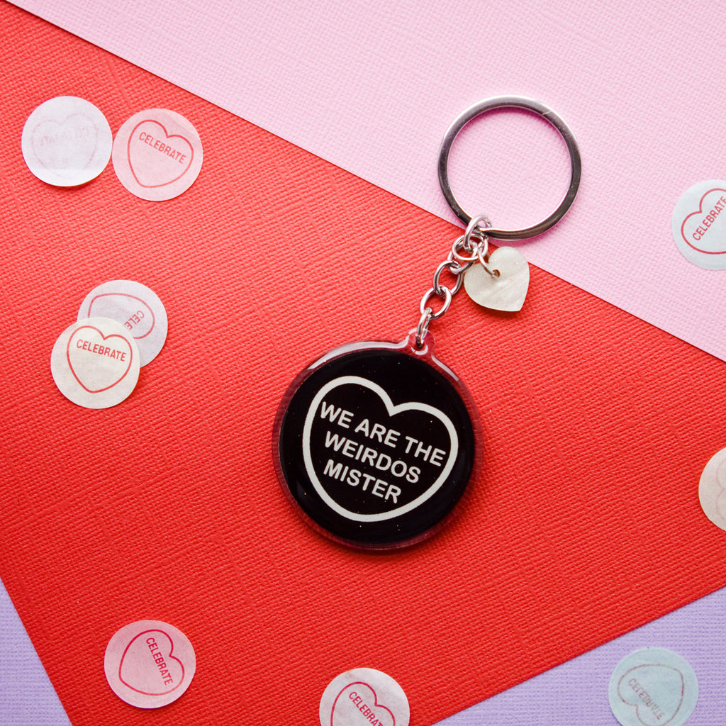 Candy & Kitsch candy heart keyring keychain sits in a kitsch interior design in the variation ’we are the weirdos mister' inspired by the craft