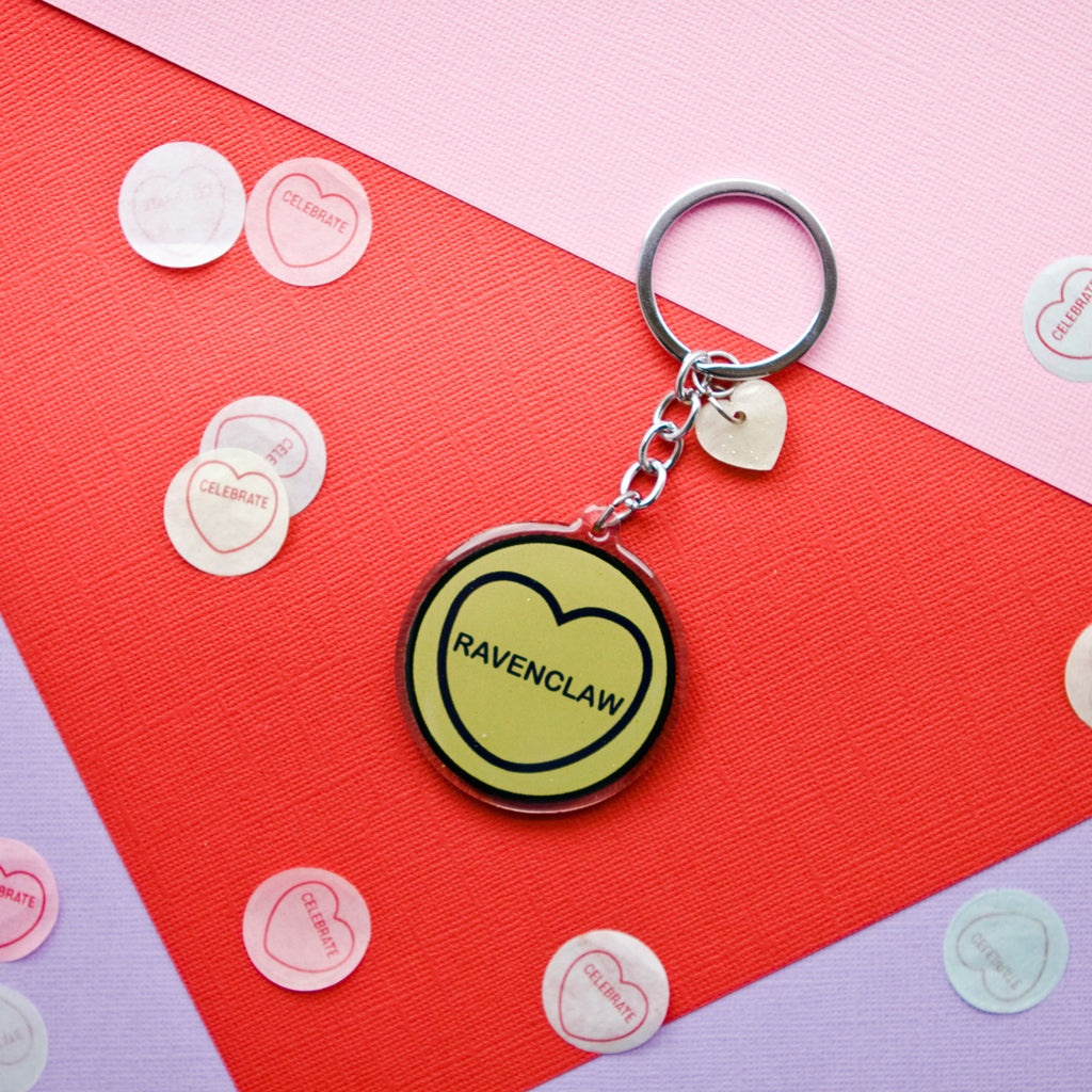 candy and kitsch harry potter candy hearts hogwarts house Ravenclaw keyring sits in a colourful background with candy heart confetti