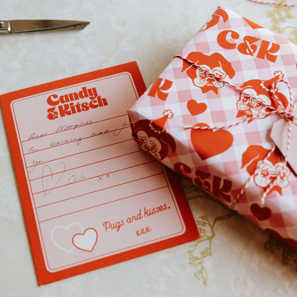Candy & Ktsch's gift wrapping service with custom giftwrap, twine, card and handwritten note